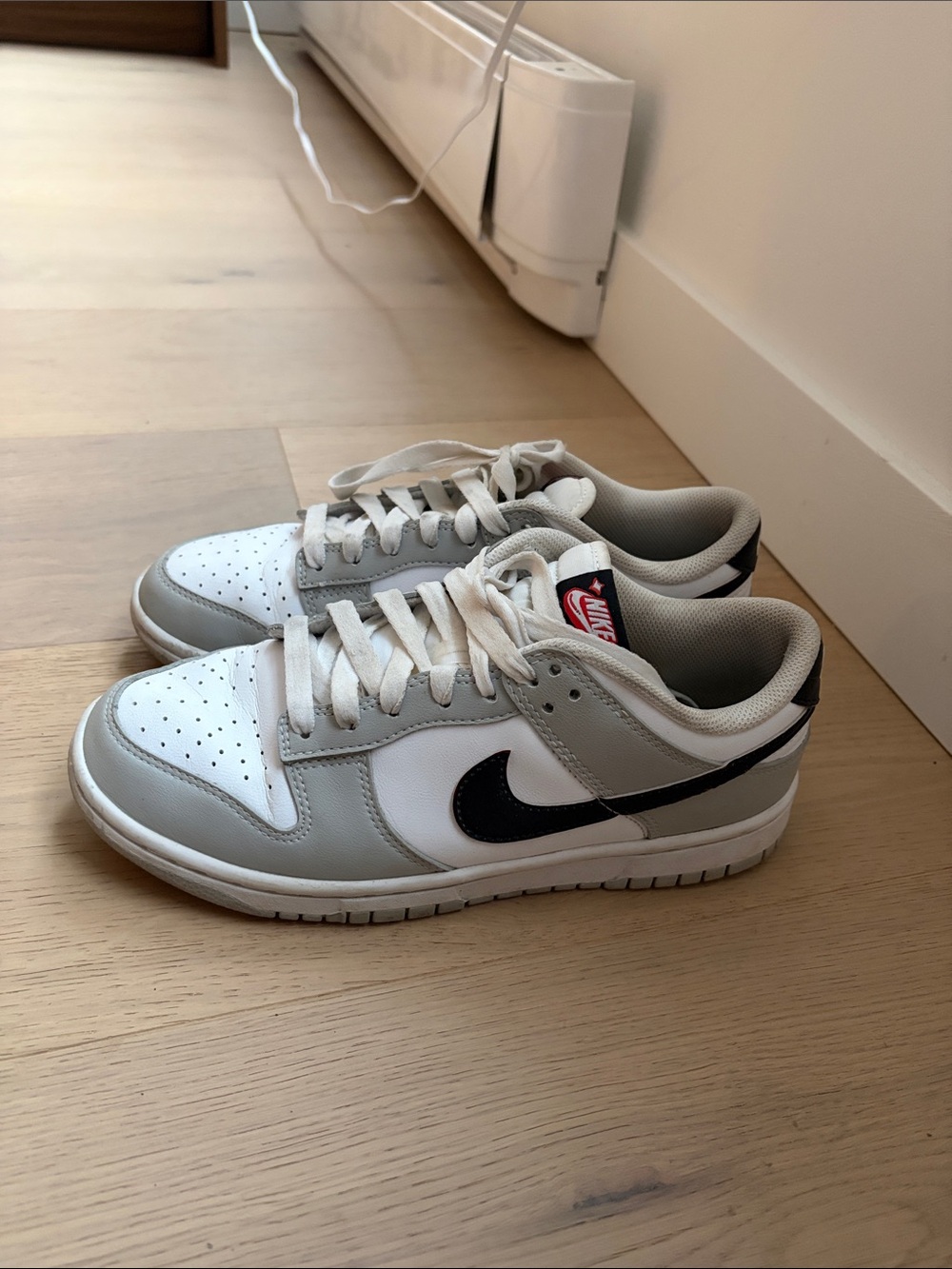 Nike White and Gray Sneakers with Black Swoosh